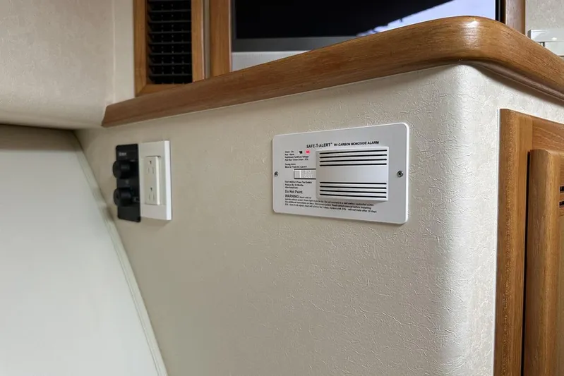 Moving Violation Yacht Photos Pics 2008 Cabo 40 interior with carbon monoxide alarm and electrical outlet.