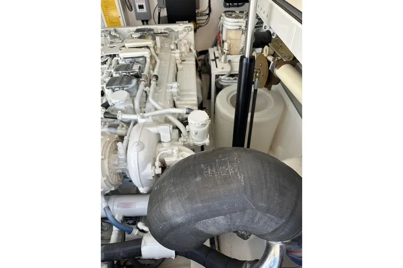 Moving Violation Yacht Photos Pics Engine compartment of a 2008 Cabo 40 boat, showcasing mechanical components.