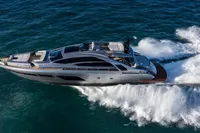 Luxurious 2020 Pershing 8X yacht cruising swiftly on open sea.
