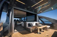 Luxurious 2020 Pershing 8X yacht with elegant outdoor seating and ocean view.