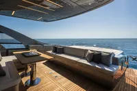 Luxurious 2020 Pershing 8X yacht deck with elegant seating and ocean view.