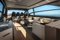 Luxurious interior of 2020 Pershing 8X yacht with modern seating and ocean view.