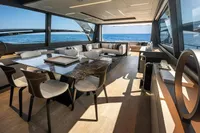 Luxurious interior of 2020 Pershing 8X yacht with ocean view and elegant furnishings.