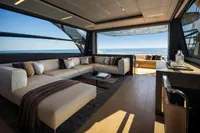 Luxurious interior of 2020 Pershing 8X yacht with ocean view and elegant seating.