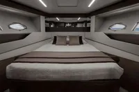 Luxurious bedroom interior of 2020 Pershing 8X yacht with modern design and elegant decor.