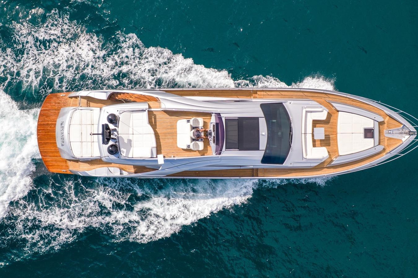 Aerial view of 2020 Pershing 8X yacht cruising on blue ocean waters.