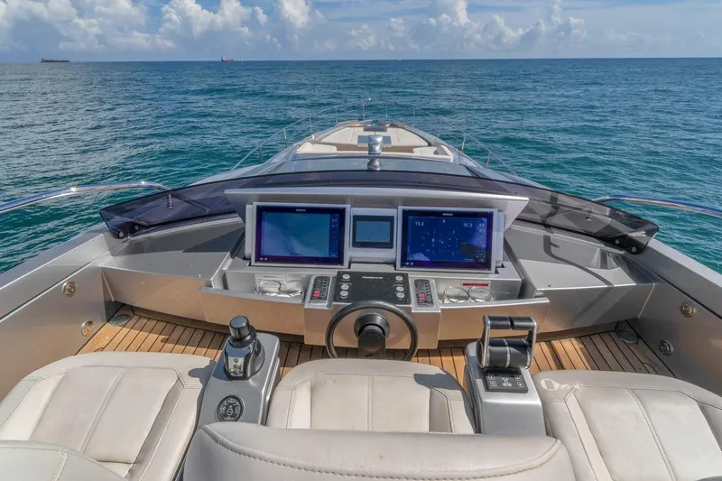Alexandra Yacht Photos Pics Cockpit view of 2020 Pershing 8X yacht with navigation screens and ocean backdrop.