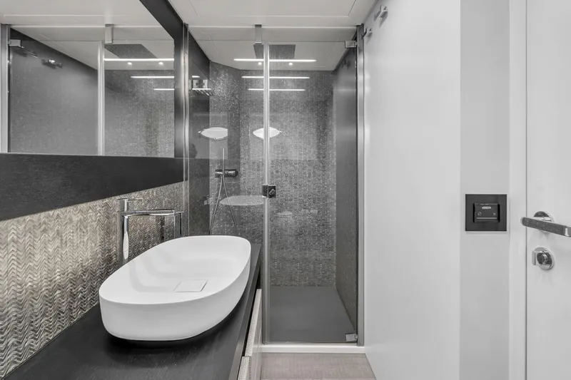 Alexandra Yacht Photos Pics Luxurious bathroom in 2020 Pershing 8X yacht with modern sink and glass shower.