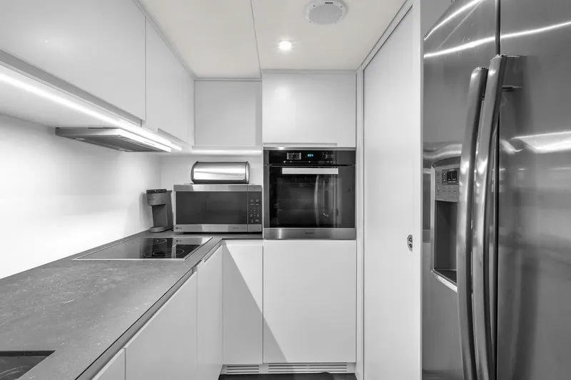 Alexandra Yacht Photos Pics Modern kitchen in 2020 Pershing 8X yacht with sleek appliances and minimalist design.