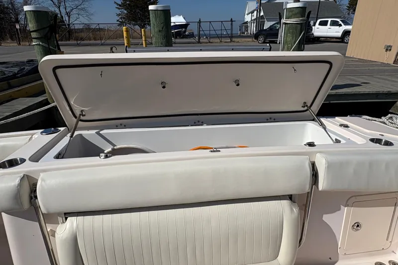  Yacht Photos Pics 2008 Grady-White Canyon 336 boat with open storage compartment at dock.