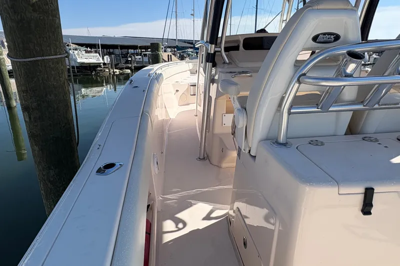  Yacht Photos Pics 2008 Grady-White Canyon 336 boat interior at marina, showcasing seating and helm.