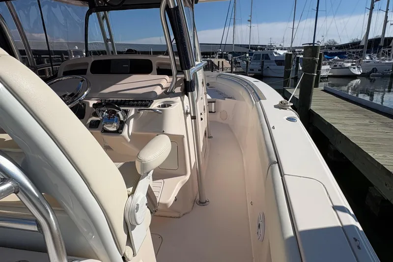  Yacht Photos Pics 2008 Grady-White Canyon 336 boat interior at marina, showcasing helm and seating area.