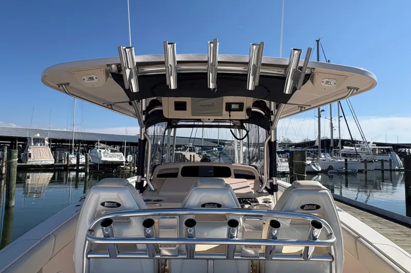  Yacht Photos Pics 2008 Grady-White Canyon 336 boat docked at marina, featuring fishing rod holders and helm.