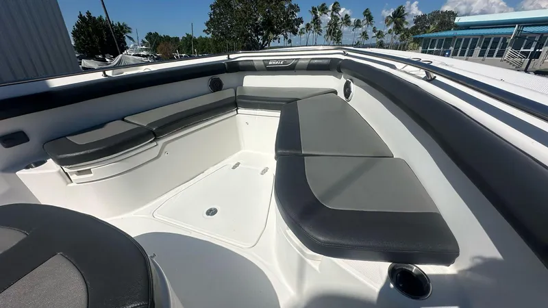  Yacht Photos Pics 2014 Boston Whaler 350 Outrage interior with cushioned seating and sleek design.