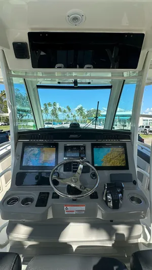  Yacht Photos Pics 2014 Boston Whaler 350 Outrage helm with advanced navigation displays and controls.