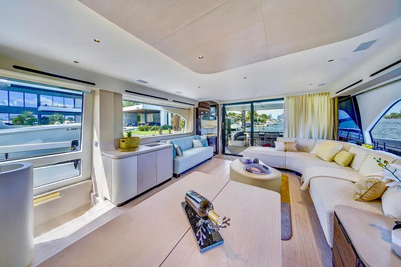 Transcendence Yacht Photos Pics Luxurious interior of 2020 Azimut 78 Flybridge yacht with elegant seating and panoramic windows.