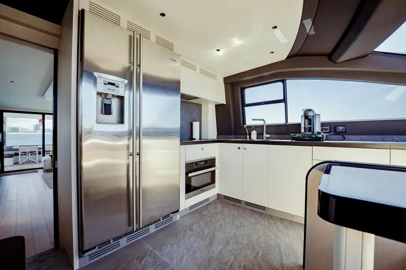 Transcendence Yacht Photos Pics Luxurious kitchen interior of 2020 Azimut 78 Flybridge yacht with modern appliances.