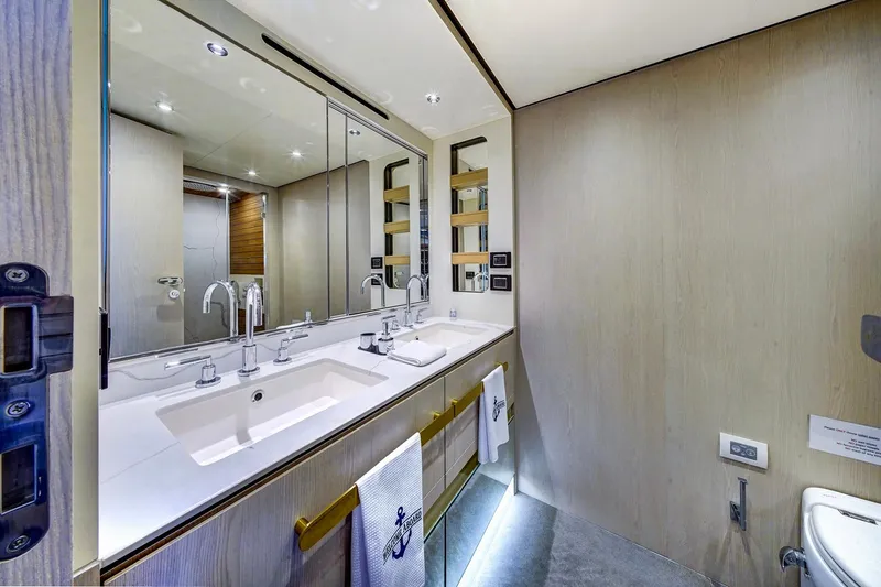 Transcendence Yacht Photos Pics Luxurious bathroom in 2020 Azimut 78 Flybridge yacht, featuring dual sinks and modern fixtures.