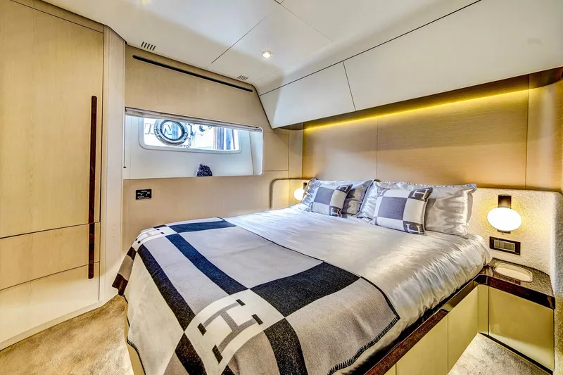 Transcendence Yacht Photos Pics Luxurious bedroom interior of 2020 Azimut 78 Flybridge yacht with modern design and cozy bedding.
