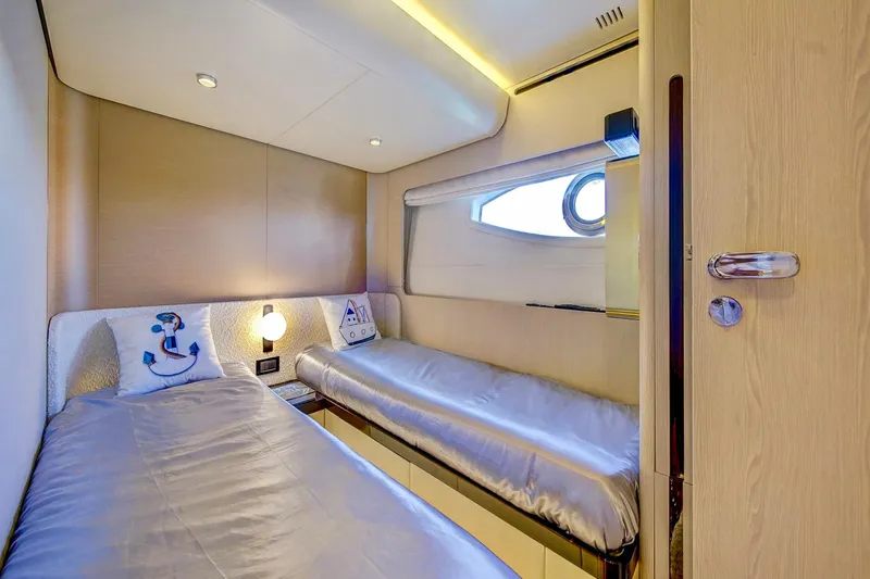 Transcendence Yacht Photos Pics Luxurious twin cabin interior on 2020 Azimut 78 Flybridge yacht, featuring modern design and nautical decor.