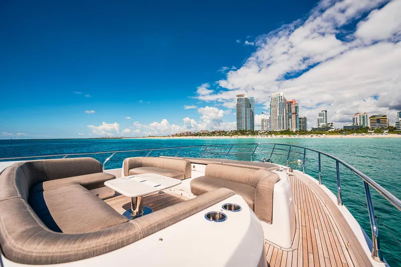 Transcendence Yacht Photos Pics Luxurious 2020 Azimut 78 Flybridge yacht with city skyline and ocean view.