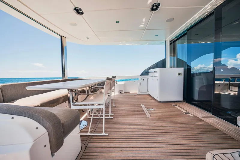 Transcendence Yacht Photos Pics Luxurious 2020 Azimut 78 Flybridge yacht deck with seating and ocean view.