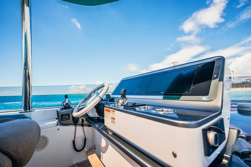 Transcendence Yacht Photos Pics Cockpit view of 2020 Azimut 78 Flybridge yacht with ocean backdrop.