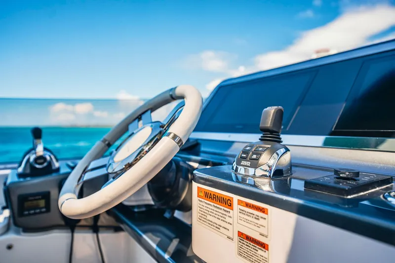 Transcendence Yacht Photos Pics Cockpit of 2020 Azimut 78 Flybridge yacht with steering wheel and controls.