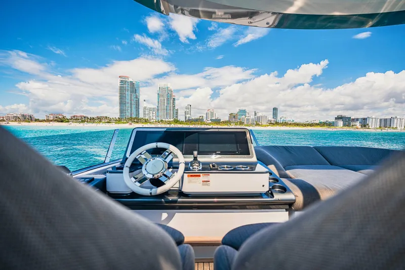 Transcendence Yacht Photos Pics Azimut 78 Flybridge 2020 yacht helm with city skyline and ocean view.