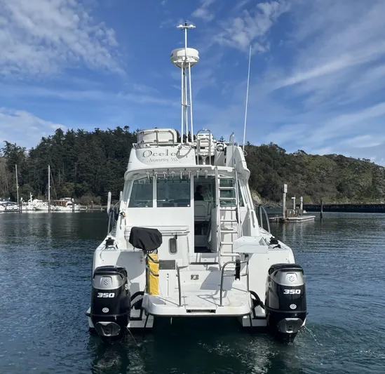 Ocelot Yacht Photos Pics 2005 Glacier Bay 3490 Ocean Runner boat docked in scenic marina.