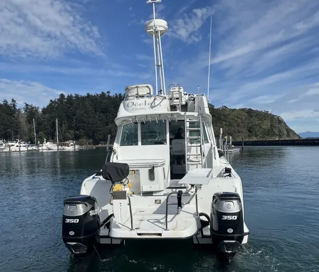 Ocelot Yacht Photos Pics 2005 Glacier Bay 3490 Ocean Runner boat with dual 350 engines on calm water.