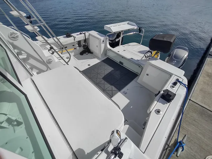 Ocelot Yacht Photos Pics 2005 Glacier Bay 3490 Ocean Runner boat docked, featuring spacious deck and modern equipment.