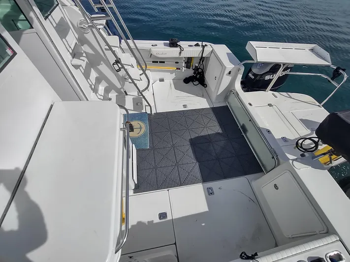 Ocelot Yacht Photos Pics 2005 Glacier Bay 3490 Ocean Runner boat deck with seating and equipment.