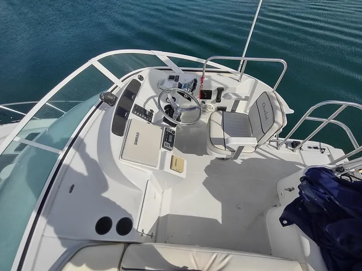 Ocelot Yacht Photos Pics 2005 Glacier Bay 3490 Ocean Runner boat cockpit with steering wheel and controls.