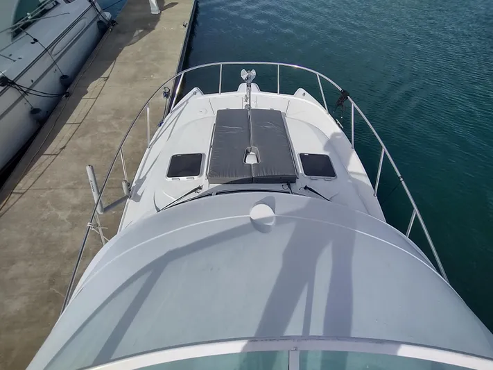 Ocelot Yacht Photos Pics 2005 Glacier Bay 3490 Ocean Runner docked at marina, aerial view.