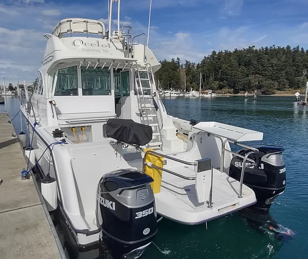 Ocelot Yacht Photos Pics 2005 Glacier Bay 3490 Ocean Runner boat docked with twin Suzuki 350 engines.