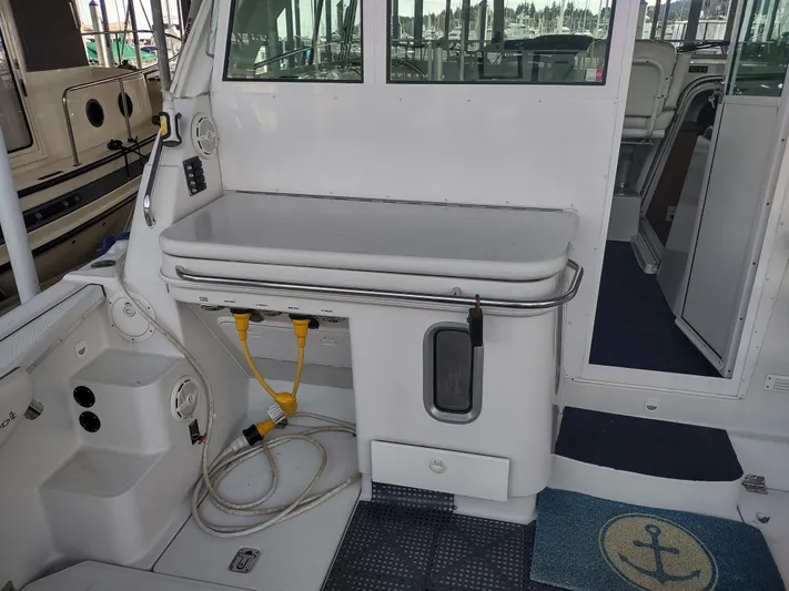 Ocelot Yacht Photos Pics 2005 Glacier Bay 3490 Ocean Runner boat interior with utility area and storage.