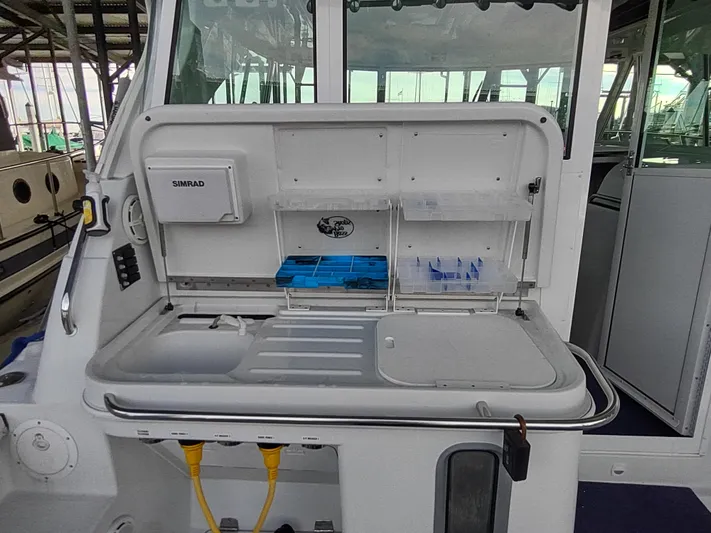 Ocelot Yacht Photos Pics 2005 Glacier Bay 3490 Ocean Runner boat interior with fishing station and storage compartments.