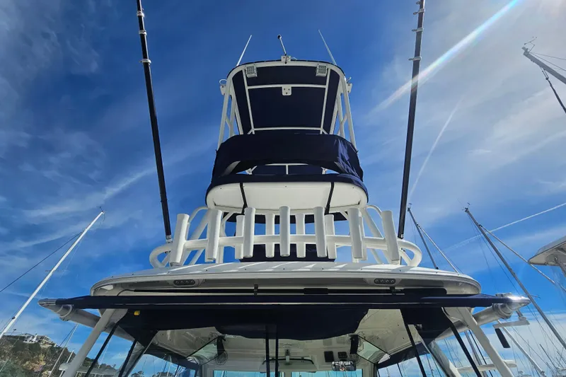 Day For It Yacht Photos Pics 2018 Boston Whaler 315 Conquest boat tower against a clear blue sky.