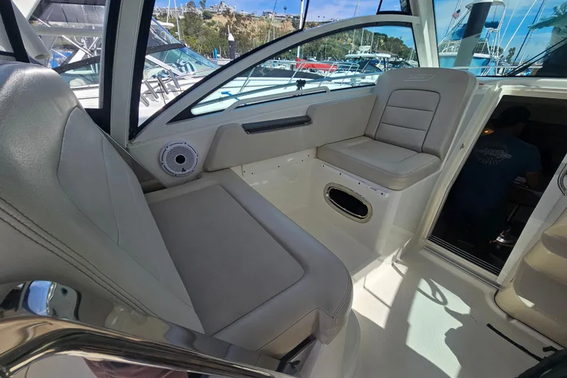 Day For It Yacht Photos Pics 2018 Boston Whaler 315 Conquest interior seating area with modern design and comfortable upholstery.