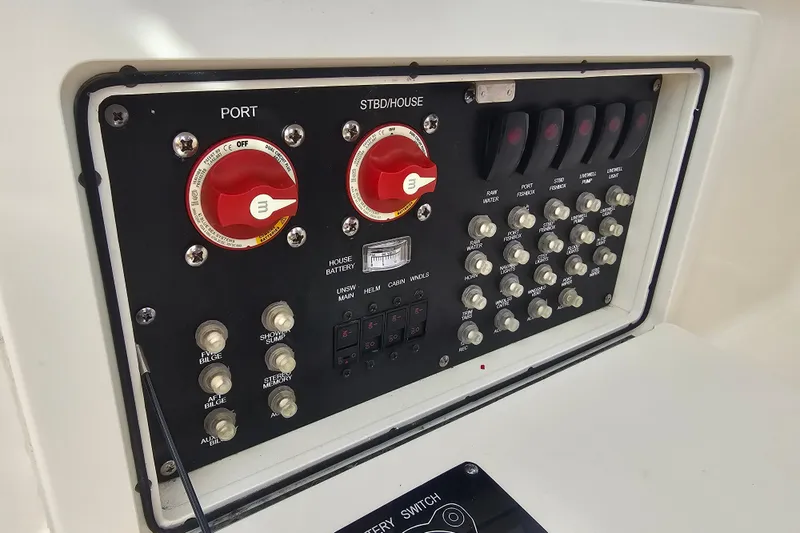 Day For It Yacht Photos Pics Control panel of a 2018 Boston Whaler 315 Conquest boat with switches and dials.