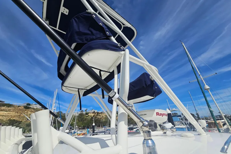 Day For It Yacht Photos Pics 2018 Boston Whaler 315 Conquest boat with blue sky and marina background.