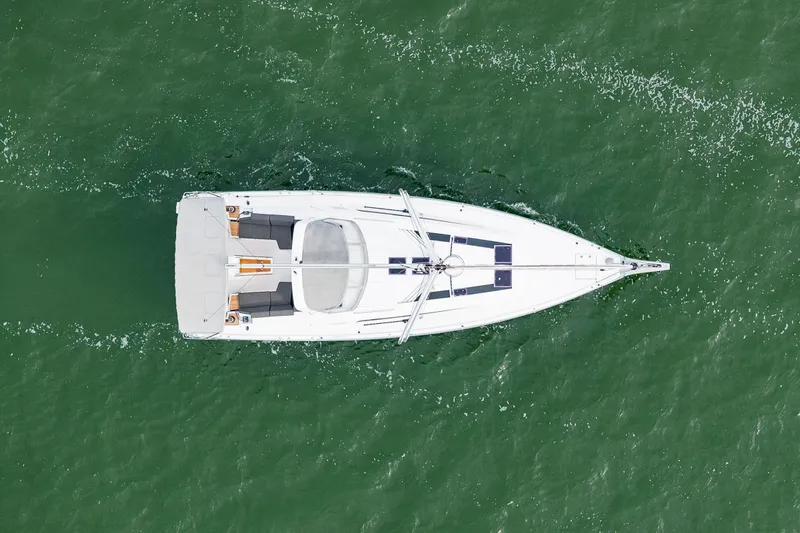 Cypress And Star II Yacht Photos Pics Aerial view of 2020 Beneteau Oceanis 46.1 sailing on green water.