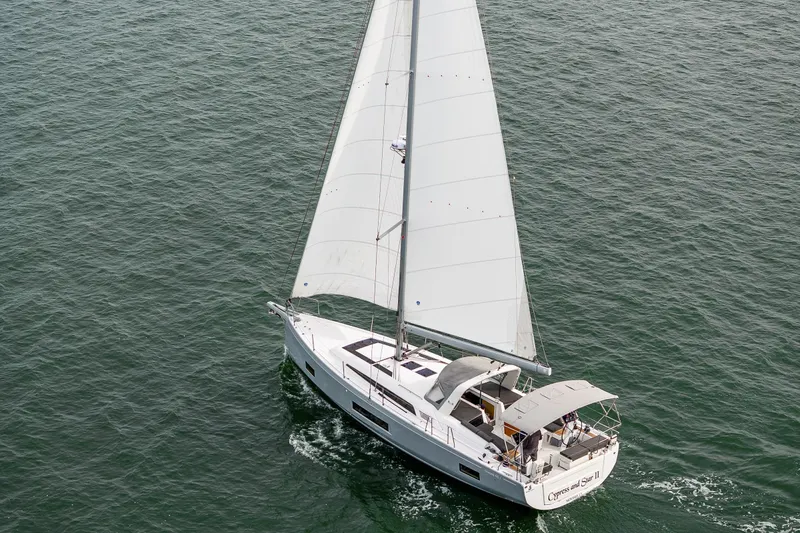 Cypress And Star II Yacht Photos Pics 2020 Beneteau Oceanis 46.1 sailing on open water, aerial view.