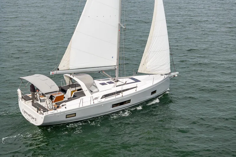 Cypress And Star II Yacht Photos Pics 2020 Beneteau Oceanis 46.1 sailing on open water, showcasing sleek design and white sails.