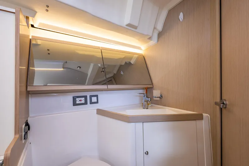 Cypress And Star II Yacht Photos Pics Modern bathroom interior of 2020 Beneteau Oceanis 46.1 yacht with sleek design.