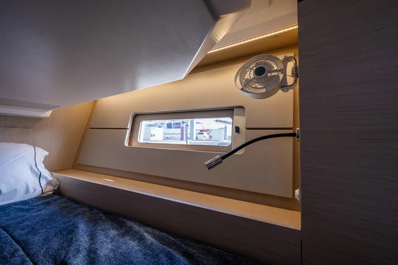 Cypress And Star II Yacht Photos Pics Interior cabin of 2020 Beneteau Oceanis 46.1 yacht with window and fan.