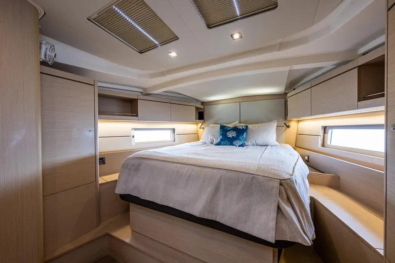 Cypress And Star II Yacht Photos Pics Luxurious cabin interior of 2020 Beneteau Oceanis 46.1 yacht with cozy bed and modern design.