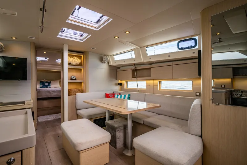 Cypress And Star II Yacht Photos Pics Luxurious interior of 2020 Beneteau Oceanis 46.1 yacht, featuring modern seating and elegant design.