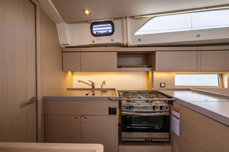 Cypress And Star II Yacht Photos Pics Modern kitchen interior of 2020 Beneteau Oceanis 46.1 yacht with stove and sink.
